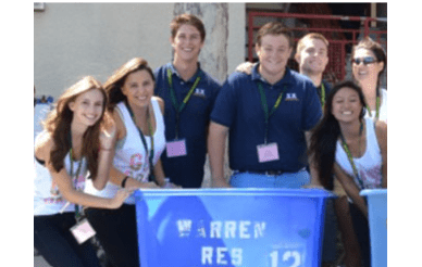 Image of students with residential life moving bins