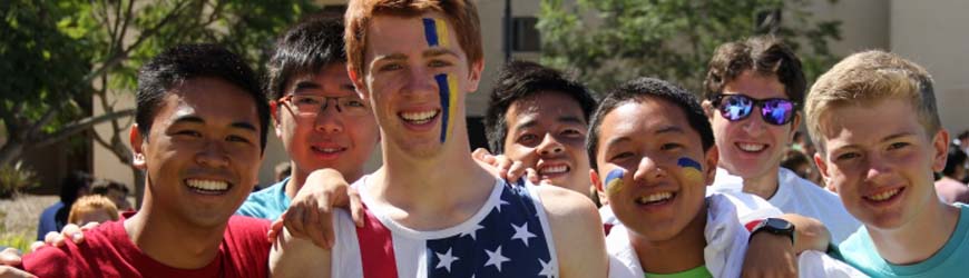 UC San Diego Students smiling with blue and gold spirit face paint